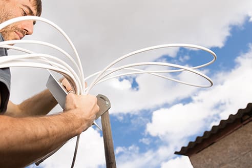 engineer installing a tv aerial